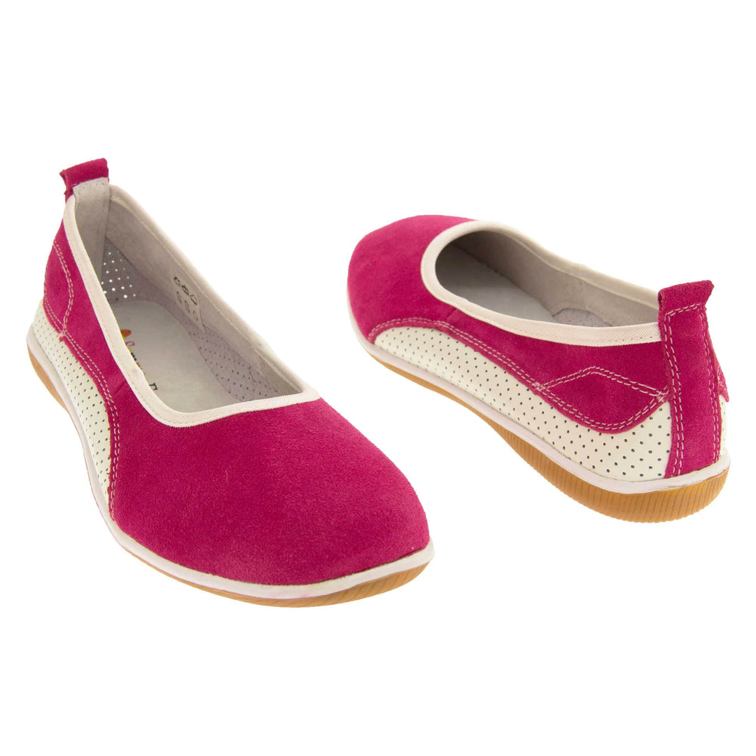 Suede ballet flat. Ballet style flat with a pink suede upper. White leather mesh runs along the bottom of the back half of the shoe. Brown sole. White edging around the sole and the opening of the shoe. White leather lining. Pink suede leather loop on heel of the shoe to help pull on. Both feet at an angle facing top to tail.