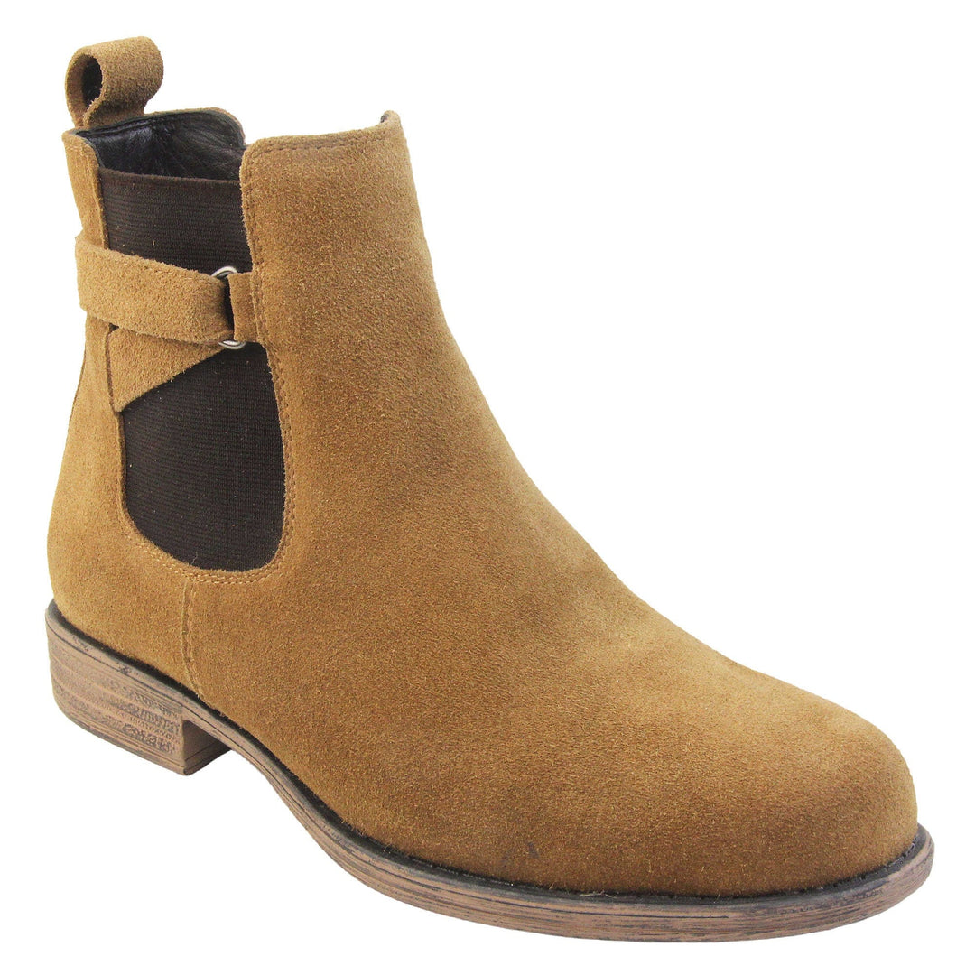 Suede leather Chelsea boots. Women's ankle boot with a tan suede upper. Black elasticated panels at the ankles with straps in a zigzag across the panel. Brown loop at the back to help pull them on. Brown sole with a slight heel. Right foot at an angle.