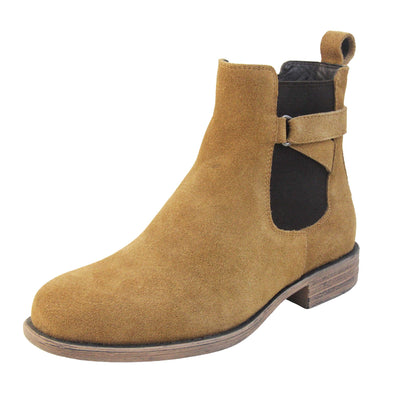 Suede leather Chelsea boots. Women's ankle boot with a tan suede upper. Black elasticated panels at the ankles with straps in a zigzag across the panel. Brown loop at the back to help pull them on. Brown sole with a slight heel. Left foot at an angle.