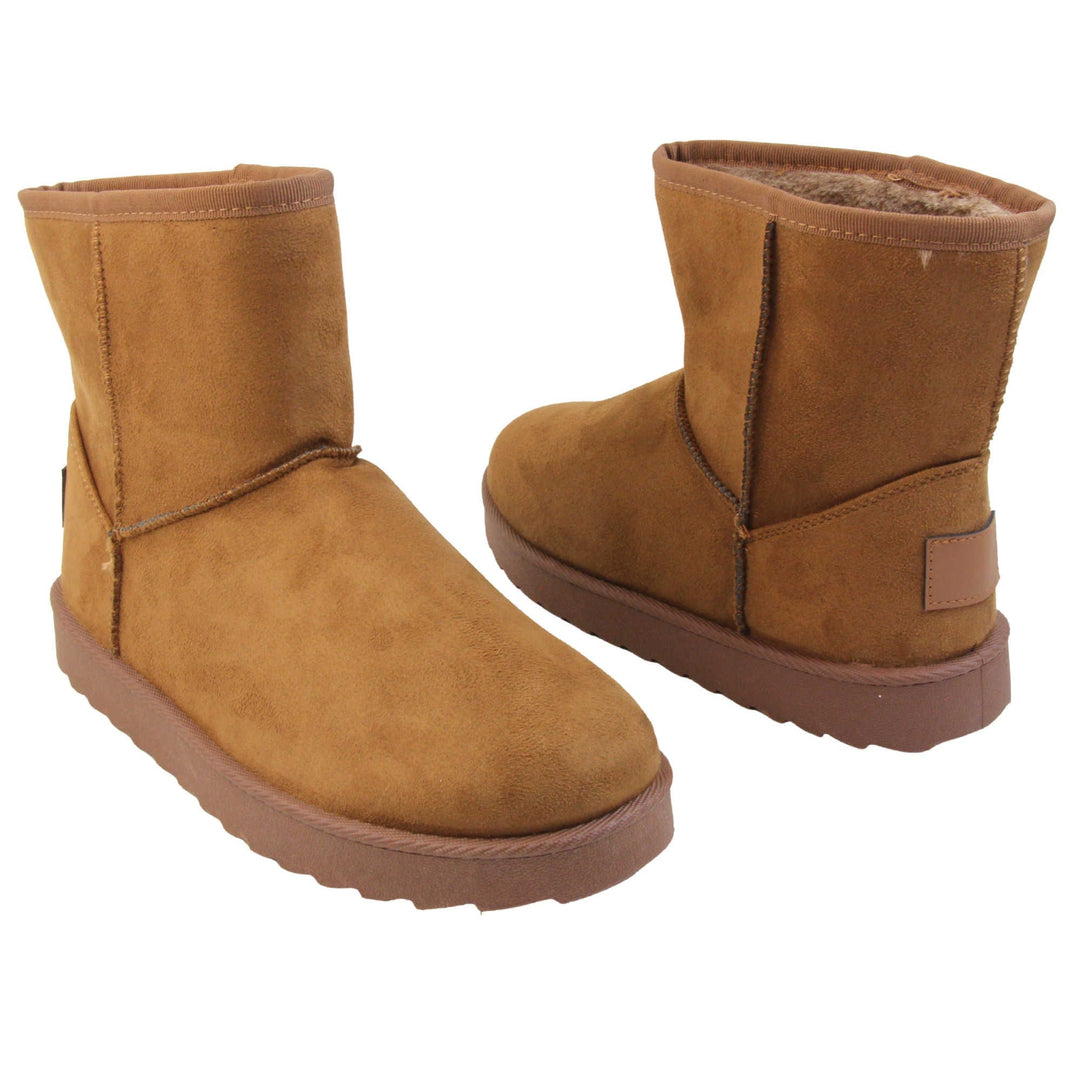 Tan winter boots women's. Ankle boots with a tan faux suede upper and stitching detail. Brown faux fur lining. Chunky brown sole with deep tread to the bottom. Both feet from a slight angle facing top to tail.