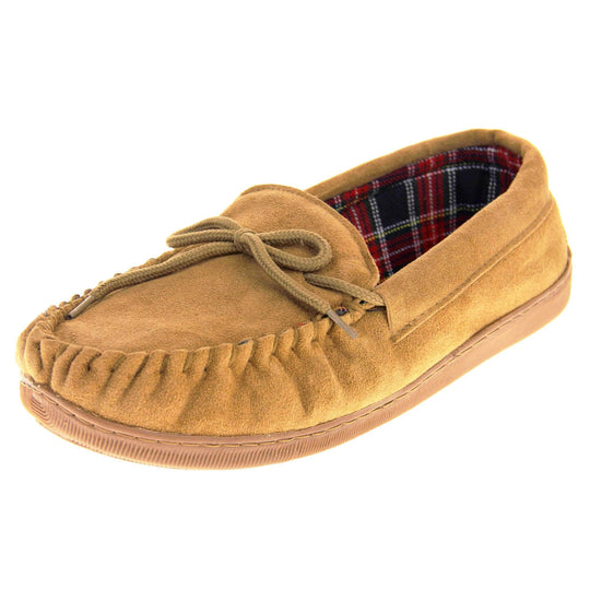Tartan slippers. Moccasin style slipper with tan suede upper and leather bow to the top. Blue and red tartan plaid lining. Beige synthetic sole. Left foot at an angle.
