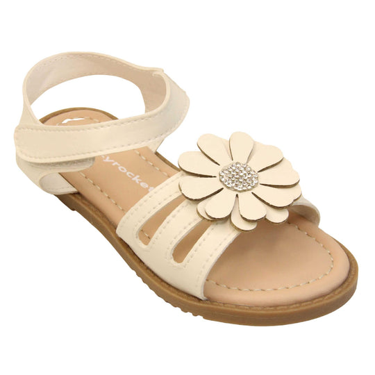 Toddler girl flower sandal. Strappy sandals with white faux leather strappy upper. With around the ankle strap with hook and loop fastening. White flower detailing to the front of the shoe with a diamante middle. Beige coloured insole with Skyrocket branding in white. Brown sole with grip to the bottom. Right foot at an angle.