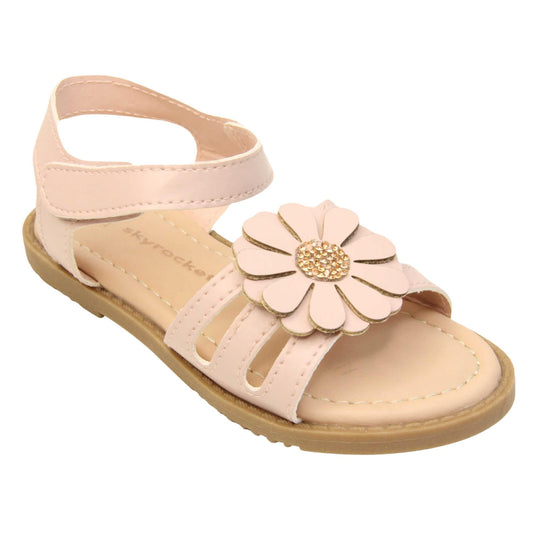 Toddler shoes girl. Strappy sandals with pale pink faux leather strappy upper. With around the ankle strap with hook and loop fastening. Pink flower detailing to the front of the shoe with a diamante middle. Beige coloured insole with Skyrocket branding in brown. Brown sole with grip to the bottom. Right foot at an angle.
