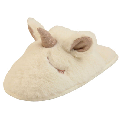 Unicorn slippers kids. Cream faux fur mule style slipper with a unicorn face stitched into the upper. Sparkly ear and horn detail to the top of the upper. Lined with the same faux fur. Left foot at an angle.