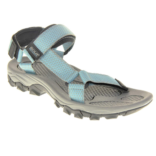 Walking sandals women. Womens sporty style sandals. Grey textile straps with blue criss-cross pattern. Black padding to the heel and over foot strap. Touch fasten strap around the heel. Black Gola branding to the ankle of the sandal. Grey textile lining and black sole with chunky grip to the base. Right foot at an angle.