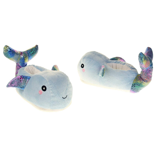 Whale slippers. Womens padded slippers shaped like a whale. With a pale blue body and head. Metallic rainbow fins and tail. Both feet at an angle, facing top to tail.