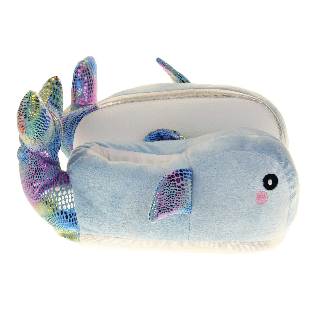 Whale slippers. Womens padded slippers shaped like a whale. With a pale blue body and head. Metallic rainbow fins and tail. Both feet from a side profile with the left foot on its side behind the the right foot to show the sole.