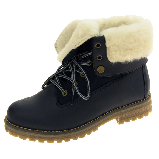 Winter boots women. Navy blue smooth leather upper with lace up fastening and eyelets, welted outsole and wool lining to boot and cuff. Left foot at angle.
