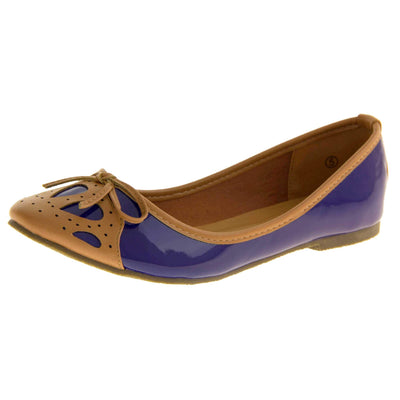 Women's ballet flats. Blue patent leather effect ballet pumps with brown faux leather collar and detailing to the toe. Brown sole with a very slight heel. Left foot at an angle.