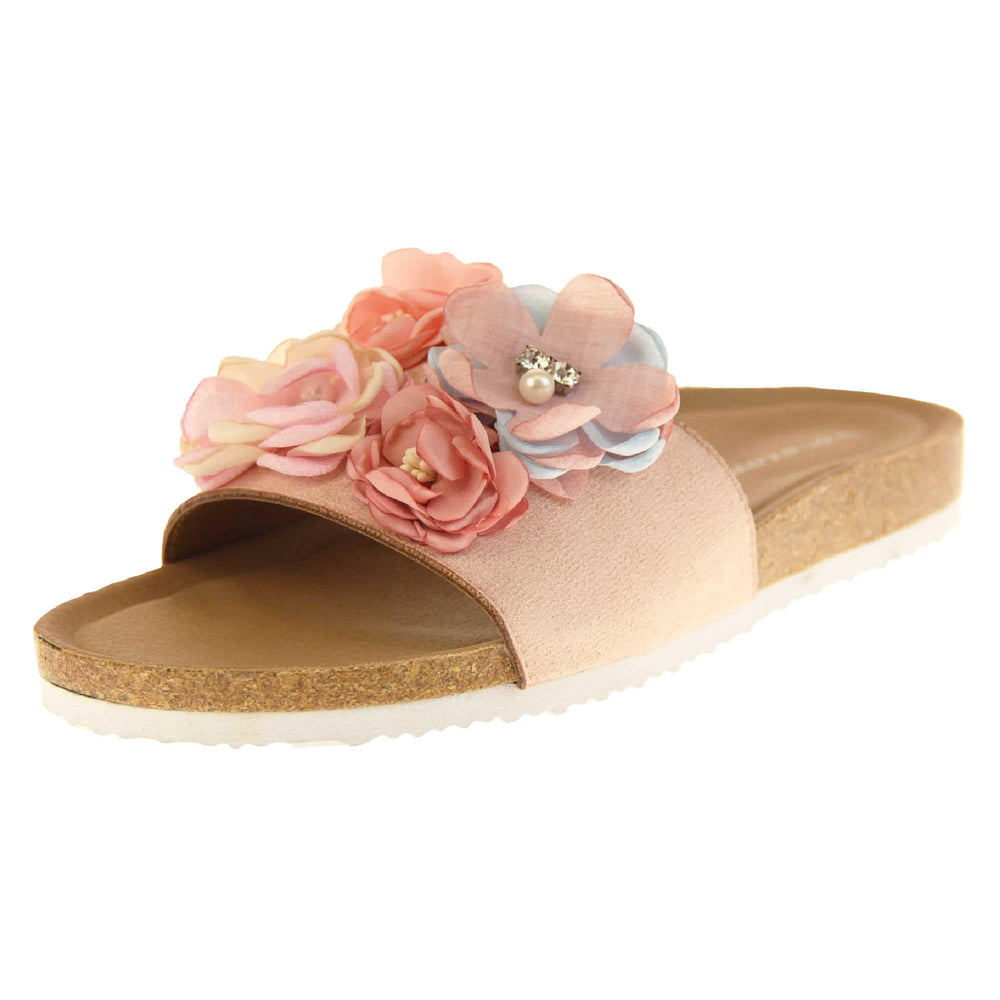 Womens Flower Sandals - Stunning festival style flowers across the top strap decorated with pearls and diamantes. Soft tan faux leather footbed sandals with white soles. Perfect for weddings, beaches, holidays or casual wear. Angled left side view.