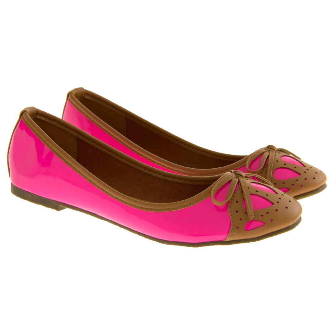 Womens ballerina shoe. Pink patent leather effect ballet pumps with brown faux leather collar and detailing to the toe. Brown sole with a very slight heel. Both feet together from a slight angle.