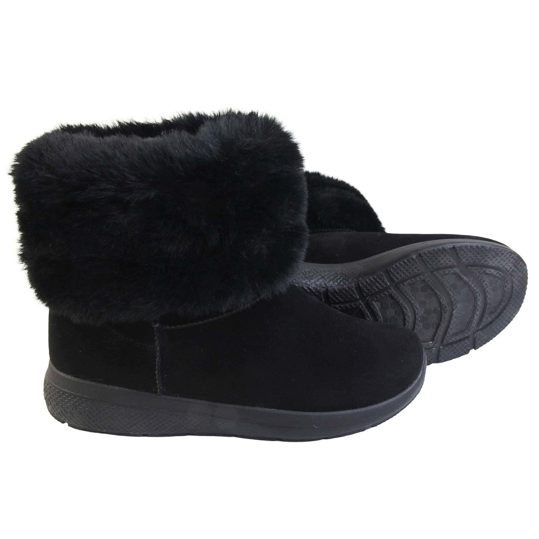 Womens Faux Fur Lined Ankle Boots - Black ankle boots with slight wedge heel, suede effect upper with soft faux fur cuff, scuff resistant bumper to front. Both feet with outsole showing.