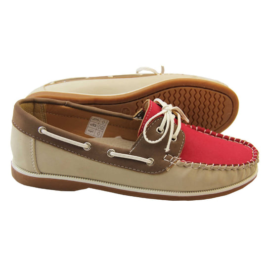 Womens Deck Shoes with Laces - Fuchsia Pink upper and tongue with contrast stitching and lace up fastening. Beige PU upper to sides and tan brown cuff and rim, with tan soles with white above. Lace cords to side in lines with eyelets in boat shoe design. Side and outsole view.