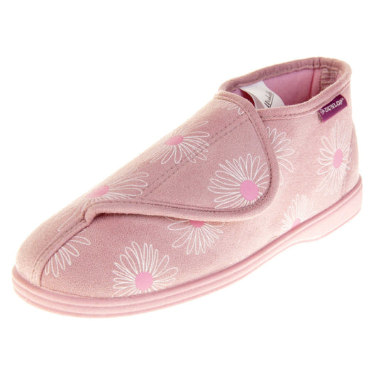 Womens bootie slippers. Ladies bootie style slipper with a pale pink textile upper with a white and pink flower print. Touch fasten tab to the top and pink textile lining. Firm pink sole. Left foot at an angle.