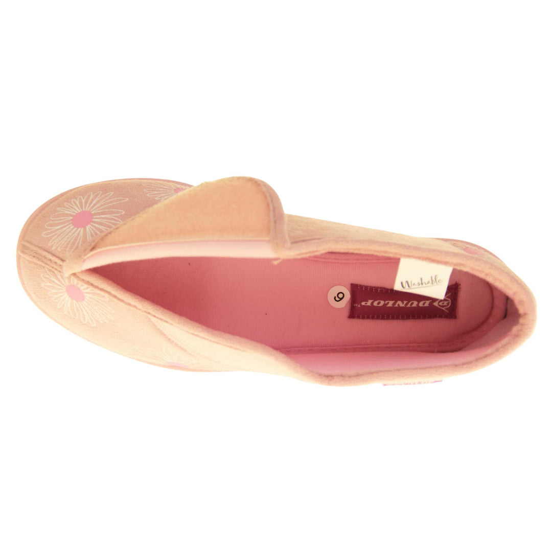 Womens bootie slippers. Ladies bootie style slipper with a pale pink textile upper with a white and pink flower print. Touch fasten tab to the top and pink textile lining. Firm pink sole. Left foot from a birds eye view with the touch fasten tab open.