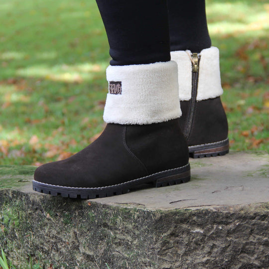 Womens Brown Ankle Boots - Brown synthetic suede upper, contrast stitching to outsole and light cream fur to cuff with 'Keddo' logo to front. Model shot in Autumn in park.