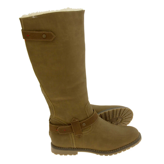 Womens brown tall boots. Almost knee high boots with a light brown faux suede upper. Brown faux leather strap around the ankle and the back half of the neck of the boot. Brown sole with chunky tread. Zip fastening down the inside of the leg. Both feet from a side profile with the left foot on its side to show the sole.