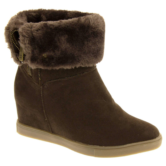 Womans calf boots. Dark brown faux suede wedge ankle boots. With zip fastening. Brown faux fur wide collar. Light brown sole with deep grip to the base. Right foot at an angle.