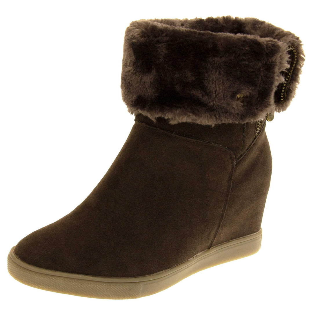 Womans calf boots. Dark brown faux suede wedge ankle boots. With zip fastening. Brown faux fur wide collar. Light brown sole with deep grip to the base. Left foot at an angle.