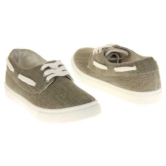 Womens canvas pumps. Sneaker style shoes with a grey canvas upper and white laces and white lace detailing around the outside of the collar. White outsole with slip-resistant grip to the bottom. Both feet at an angle facing top to tail.
