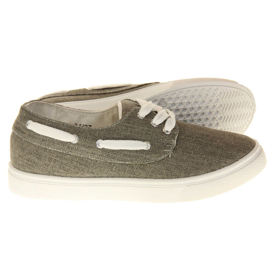 Womens canvas pumps. Sneaker style shoes with a grey canvas upper and white laces and white lace detailing around the outside of the collar. White outsole with slip-resistant grip to the bottom. Both feet from a side profile with the left foot on its side behind the the right foot to show the sole.