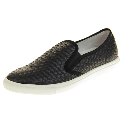 Womens casual loafers. Slip on loafer style shoe with a black woven textile upper. Black elasticated side gussets and plain black textile around collar. White flat sole and cream leather lining. Left foot at an angle.