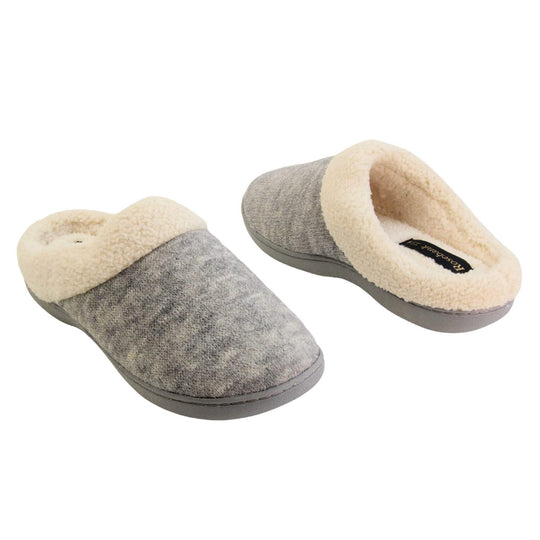 Womens cotton slippers. Womens slippers in a mule style. With grey cotton knit uppers and cream faux fur collar and lining. Grey hard synthetic soles with grip to the base. Both shoes spaced apart, facing top to tail at an angle.