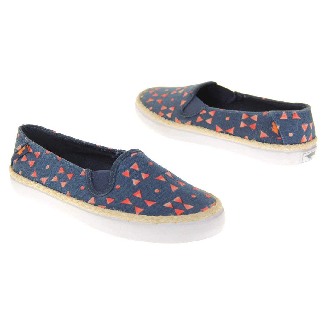 Womens espadrille flats. Plimsoll style shoes with a navy blue canvas upper with a red triangle design on it. Small Rocket Dog label to the heel. White outsole with espadrille rope around the top. Both feet at an angle facing top to tail.