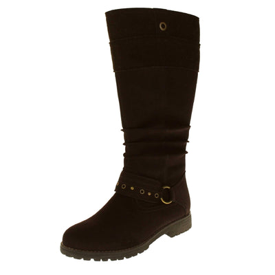Womens faux suede knee high boot. Tall boots with a dark brown faux nubuck leather upper with a felt decorative cuff around the top. A strap with stud embellishment goes around the front of the ankle connected by a gold loop. Stitching detail around the outsole and the ankle. Full length zip to the inside leg. Left foot at an angle.