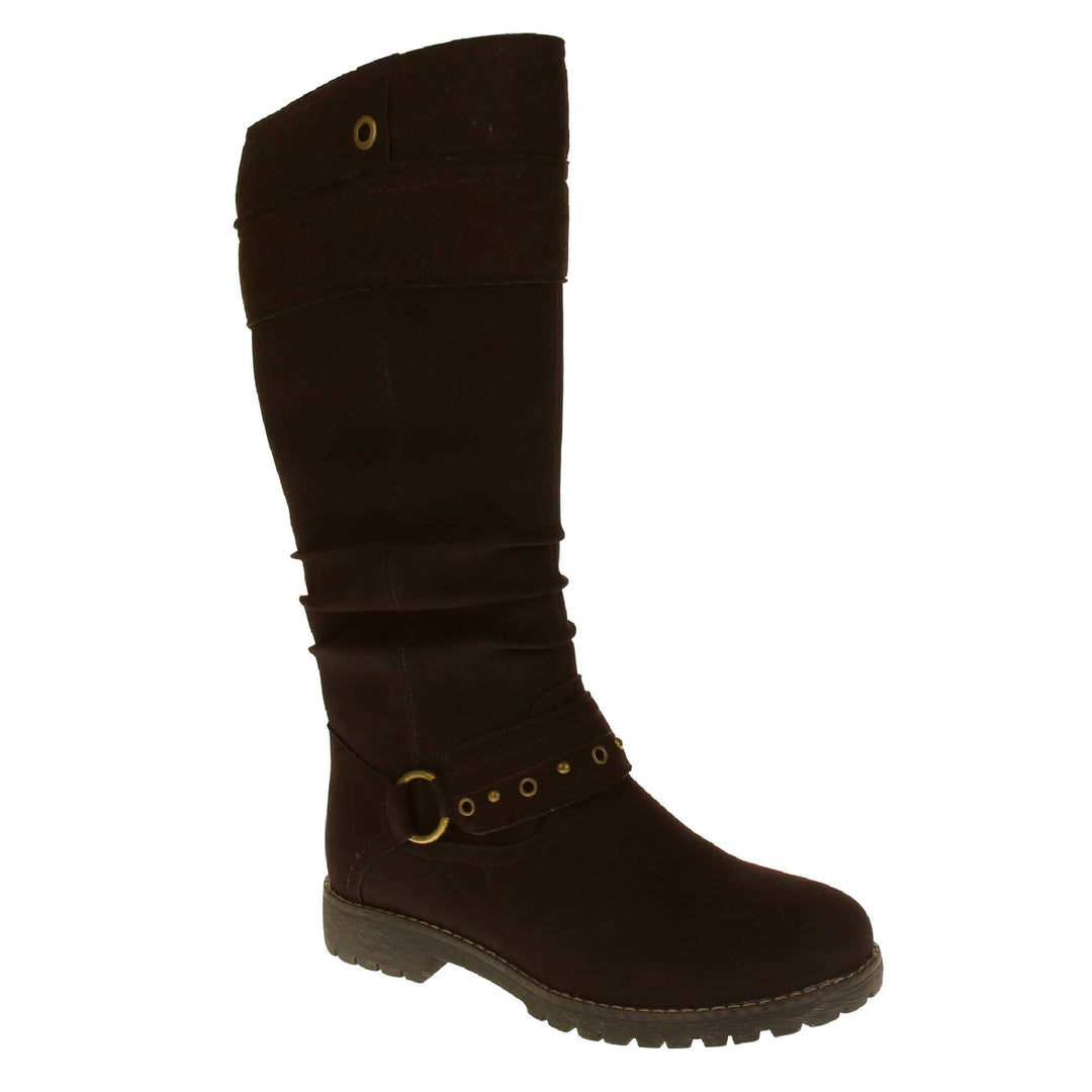 Womens faux suede knee high boot. Tall boots with a dark brown faux nubuck leather upper with a felt decorative cuff around the top. A strap with stud embellishment goes around the front of the ankle connected by a gold loop. Stitching detail around the outsole and the ankle. Full length zip to the inside leg. Right foot at an angle.