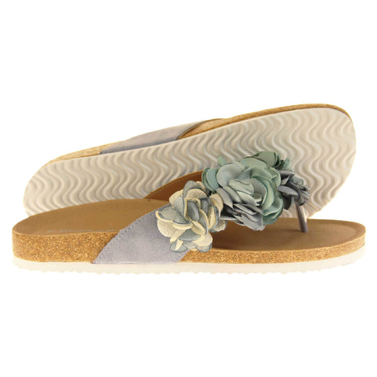 Womens Blue Floral Sandals - Stunning festival style flowers across the top strap in different shades of blue and cream with toepost to front. Soft tan faux leather footbed sandals with white soles. Perfect for weddings, beaches, holidays or casual wear. Side and outsole view.