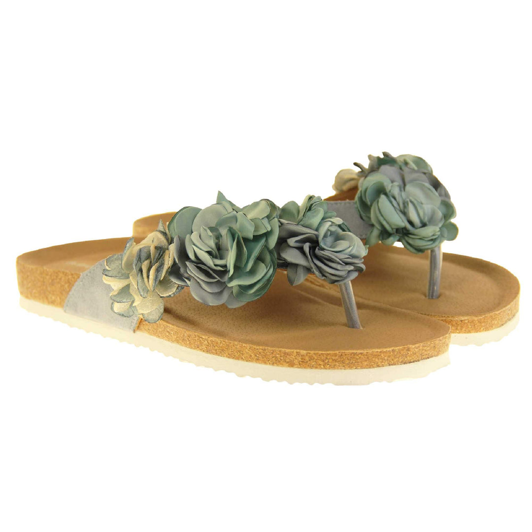 Womens Blue Floral Sandals - Stunning festival style flowers across the top strap in different shades of blue and cream with toepost to front. Soft tan faux leather footbed sandals with white soles. Perfect for weddings, beaches, holidays or casual wear. Both feet view.