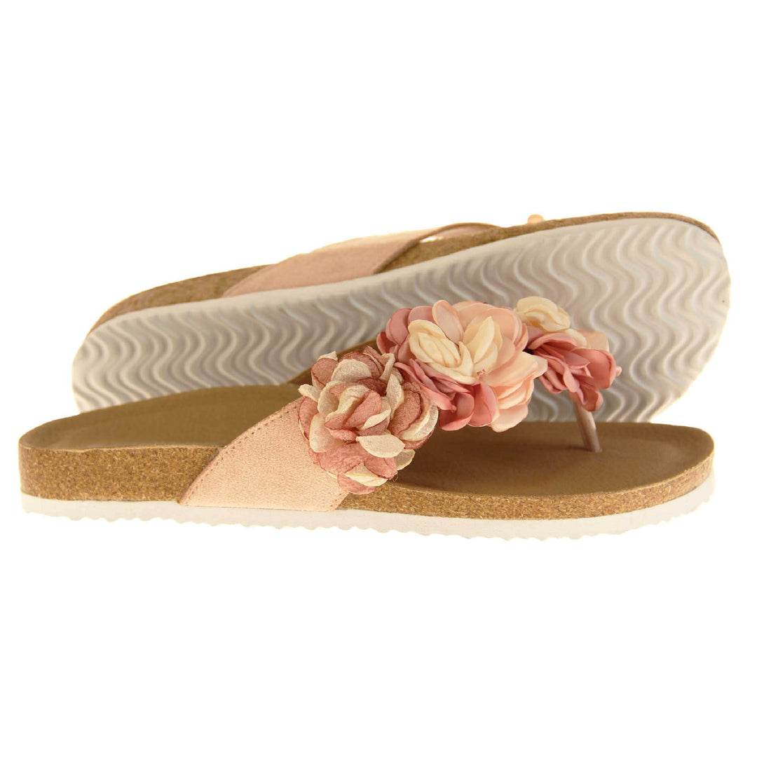 Womens Pink Floral Sandals - Stunning festival style flowers across the top strap in different shades of pink and cream with toepost to front. Soft tan faux leather footbed sandals with white soles. Perfect for weddings, beaches, holidays or casual wear. Side and outsole view.