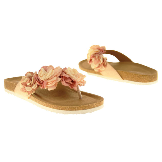 Womens Pink Floral Sandals - Stunning festival style flowers across the top strap in different shades of pink and cream with toepost to front. Soft tan faux leather footbed sandals with white soles. Perfect for weddings, beaches, holidays or casual wear. Both feet facing opposite directions.