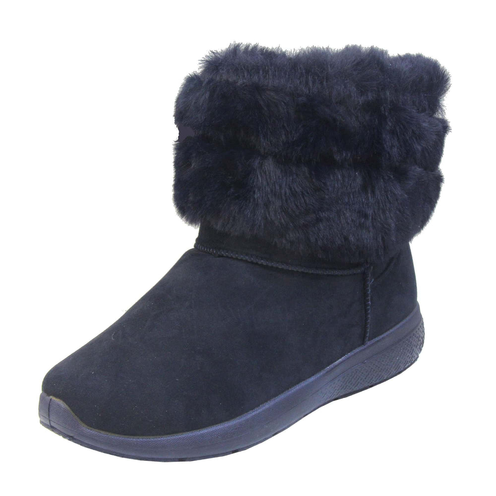 Womens Faux Fur Lined Winter Boots - Navy Blue ankle boots with slight wedge heel, suede effect upper with soft faux fur cuff, scuff resistant bumper to front. Left foot at a diagonal.