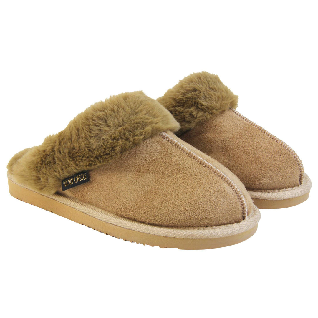 Womens Ivory Castle Slippers. Mule style slippers with taupe faux suede uppers. Taupe faux fur lining and collar. Firm taupe outsole with grip on the bottom. Both feet together at an angle.