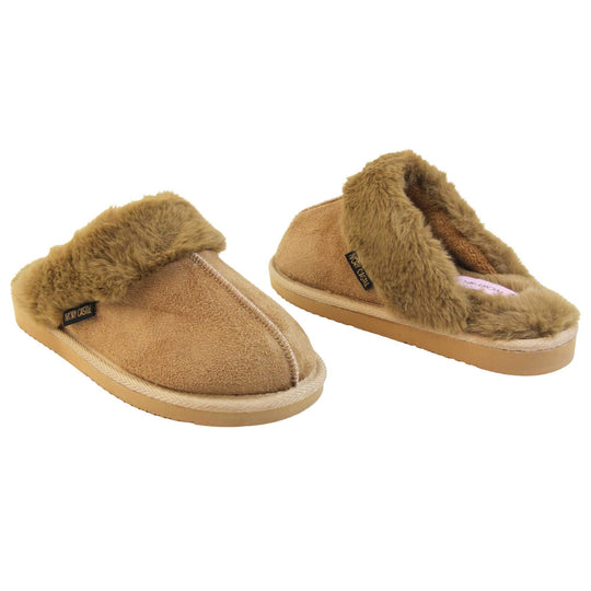 Womens Ivory Castle Slippers. Mule style slippers with taupe faux suede uppers. Taupe faux fur lining and collar. Firm taupe outsole with grip on the bottom. Both feet at an angle, facing top to tail.
