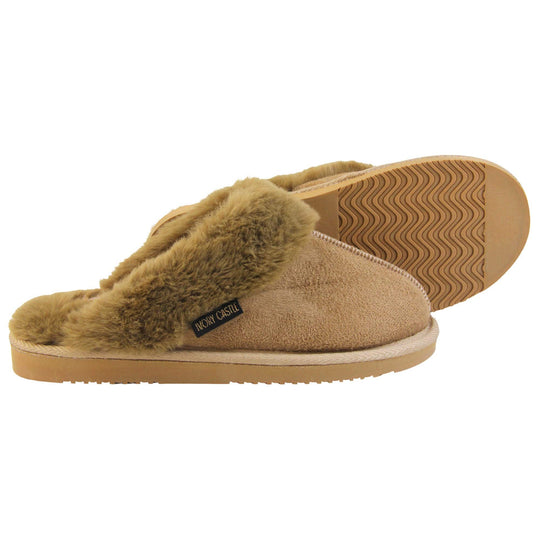 Womens Ivory Castle Slippers. Mule style slippers with taupe faux suede uppers. Taupe faux fur lining and collar. Firm taupe outsole with grip on the bottom. Both feet from a side profile with the left foot on its side behind the the right foot to show the sole.