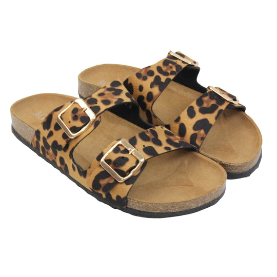 Leopard print sandals. Womens dual strap slip on sandals. With a leopard print synthetic suede upper with a gold buckle on each strap. Brown faux suede insole with a moulded footbed. Cork effect outsole with black base with grip to the bottom. Both feet together at a slight angle.