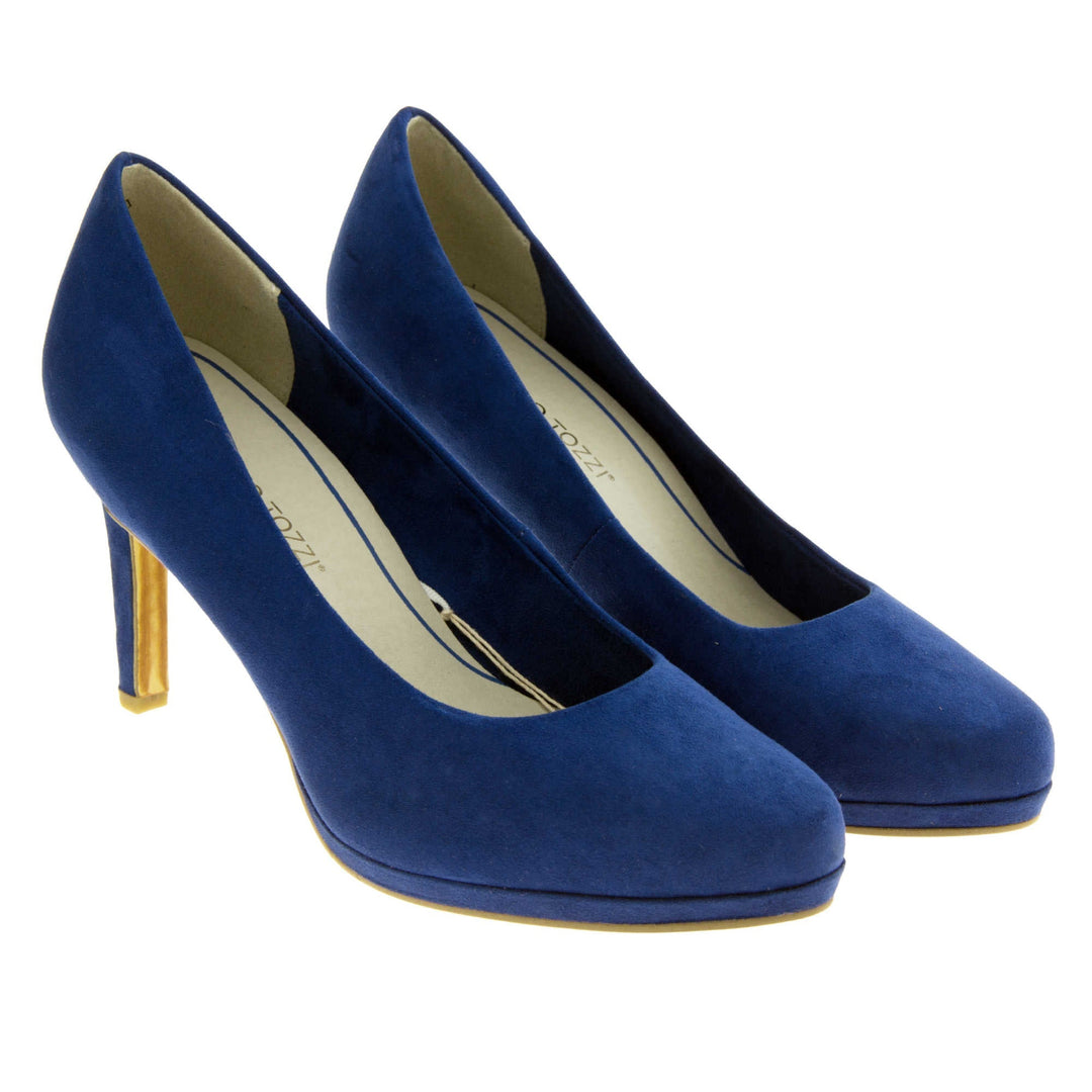 Womens navy court shoes.. Womens high heels with a faux suede navy blue upper. Cream insole with Marco Tozzi branding. Navy and beige faux suede lining. Navy faux suede mid stiletto heel. Brown sole. Both feet together at a slight angle.