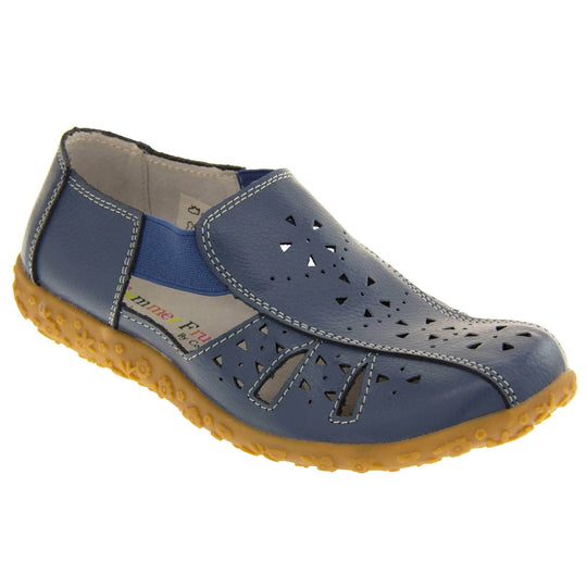 Womens navy sandals. Navy blue leather closed toe sandals with white stitched detailing. With small cut out details on the upper. Blue elasticated strips from tongue to ankle to allow more room for a better fit. Cream coloured leather insole and lining. Brown sole with heel having a slight platform with raised flower design for grip. Right foot at an angle.