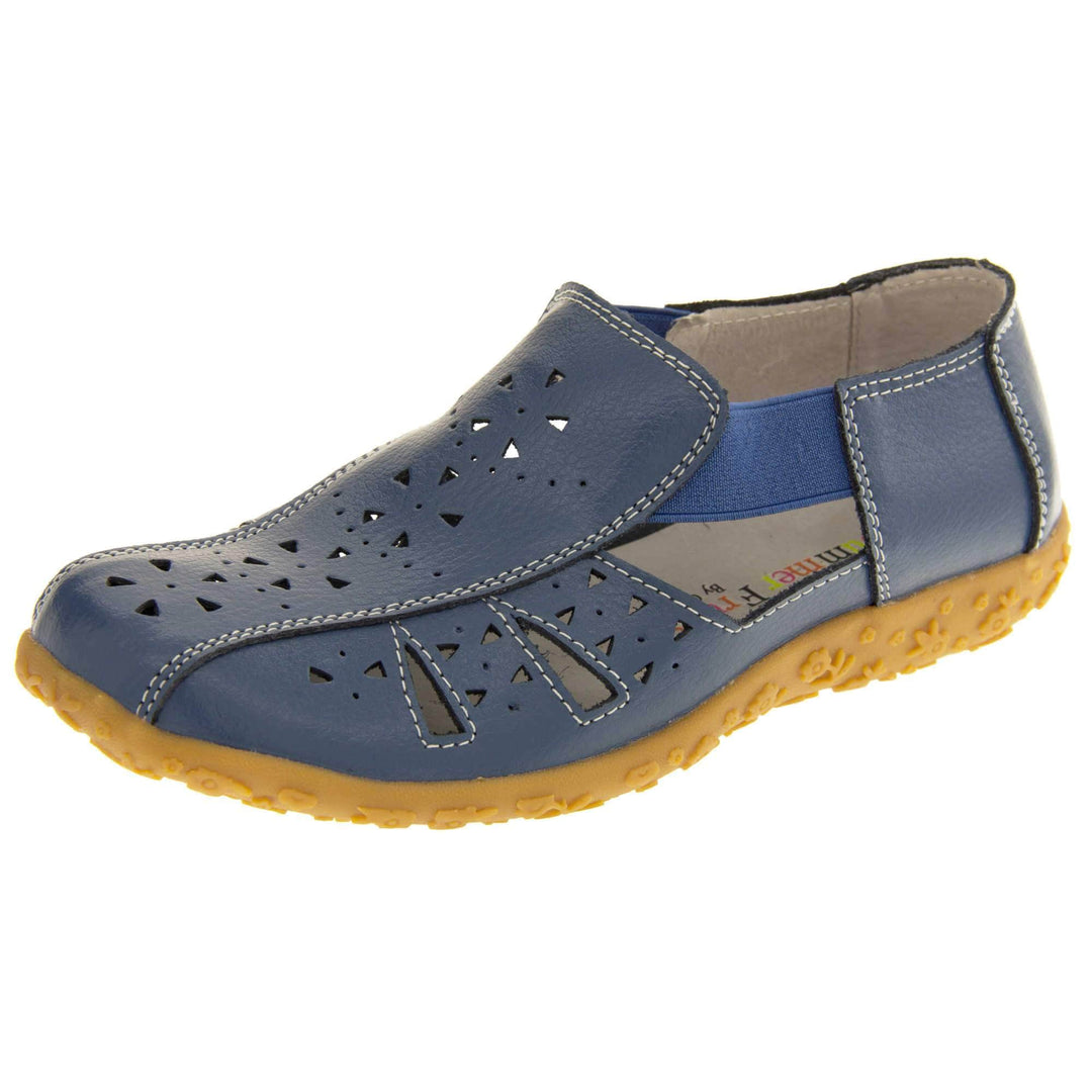 Womens navy sandals. Navy blue leather closed toe sandals with white stitched detailing. With small cut out details on the upper. Blue elasticated strips from tongue to ankle to allow more room for a better fit. Cream coloured leather insole and lining. Brown sole with heel having a slight platform with raised flower design for grip. Left foot at an angle.