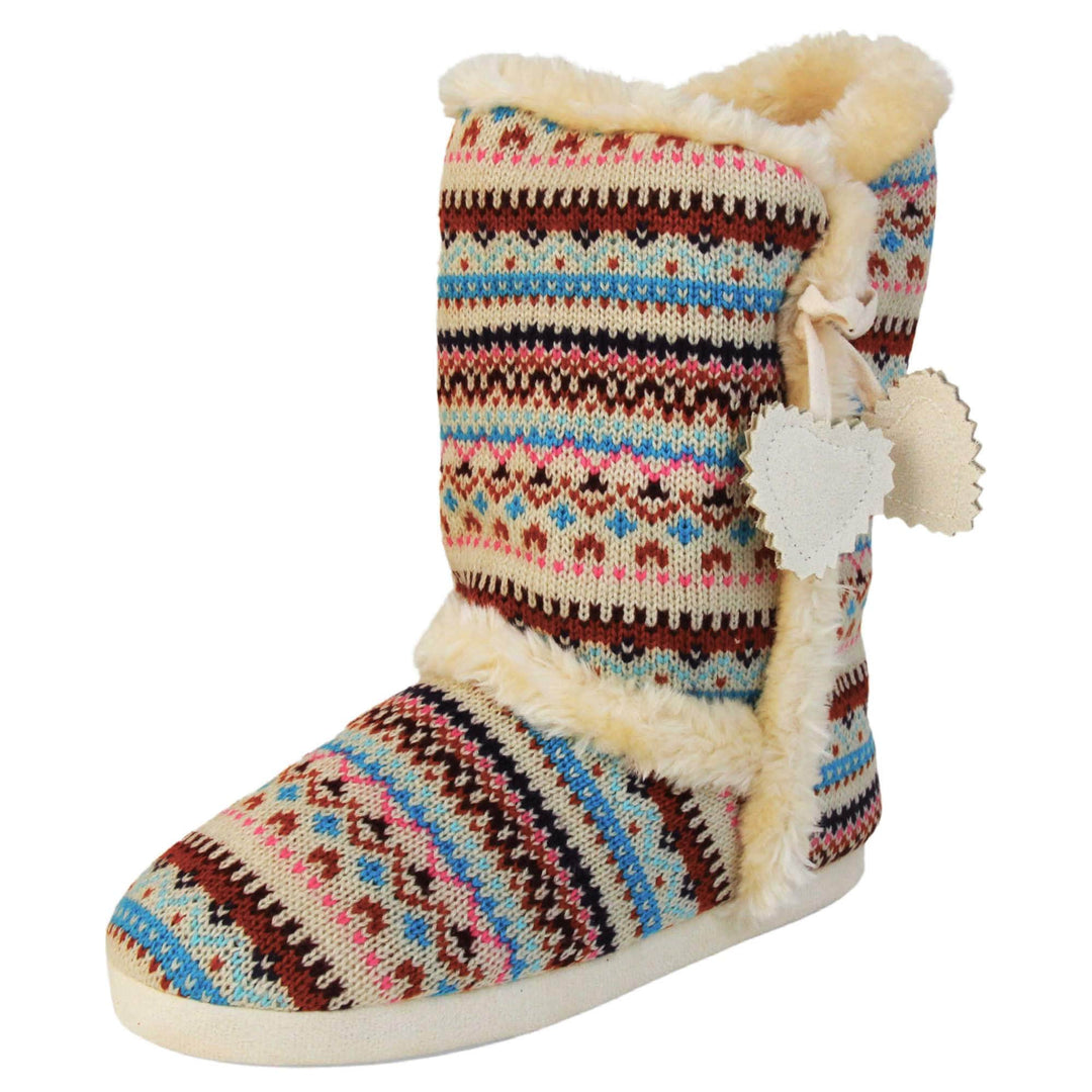 Womens Nordic Slipper Boots - Cream multi Christmas knit upper in nordic & scandinavian style with felt love heart tassles to the side, light beige plush faux fur trim and lining. Left foot taken at angle.