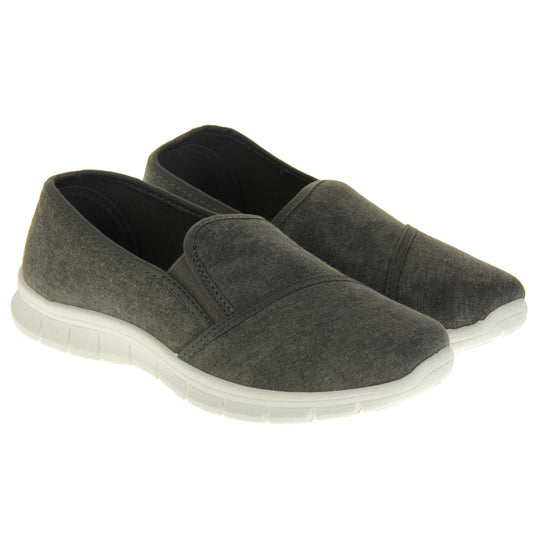 Women's plimsolls grey. Slip on plimsoll style shoes with a grey canvas upper. Grey elasticated gusset. Chunky white sole. Both feet together at a slight angle.