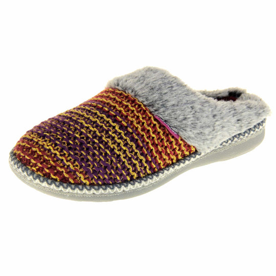 Womens purple slippers. Mule style slippers with purple and red knit uppers with metallic gold thread running through. Grey faux fur collar. Red textile lining and firm grey outsole with grip on the bottom. Left foot at an angle.