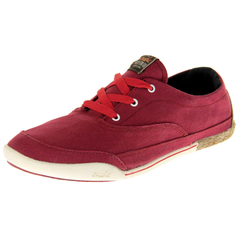 Women's Red Pumps. Sneaker style shoes with a red canvas upper and red laces. Cushe Hoffman label on the tongue. White and red outsole with the heel being espadrille style. Left foot at an angle.