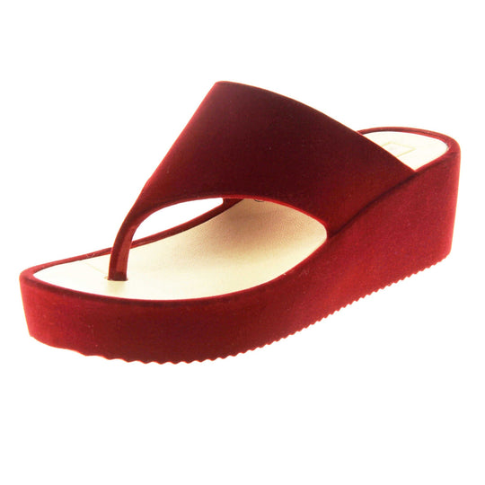 Womens Red Wedge Sandals - Red velvet shoes with 2 inch wedge heels and an open toe post design. Left foot at angle.