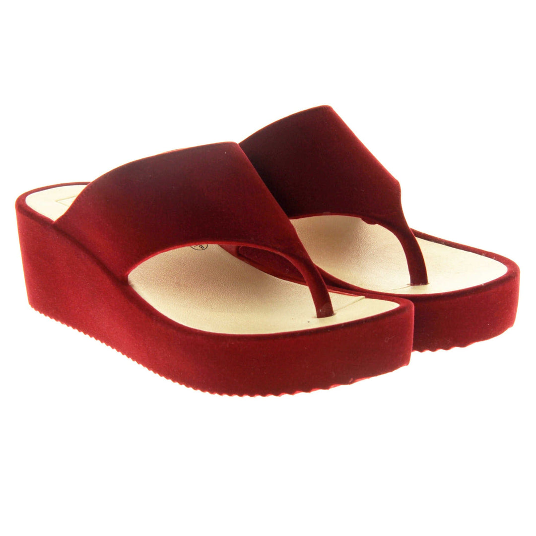 Womens Red Wedge Sandals - Red velvet shoes with 2 inch wedge heels and an open toe post design. Both feet together at angle.