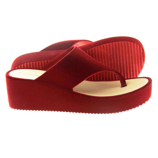 Womens Red Wedge Sandals - Red velvet shoes with 2 inch wedge heels and an open toe post design. Right foot side on with left foot outsole showing striped grips.