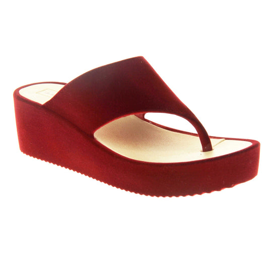 Womens Red Wedge Sandals - Red velvet shoes with 2 inch wedge heels and an open toe post design. Right foot at angle.